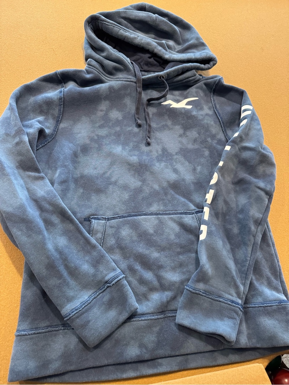 Hollister Men's Washed Navy Pullover Hoodie with White Logo